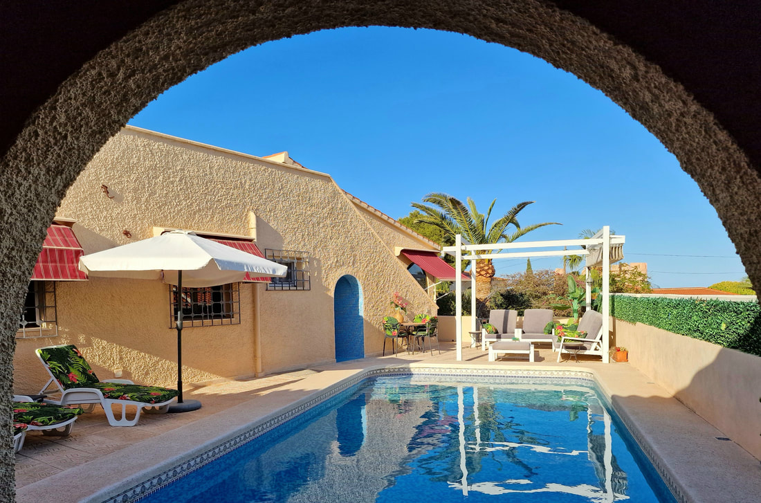Pool framed by the terrace arch