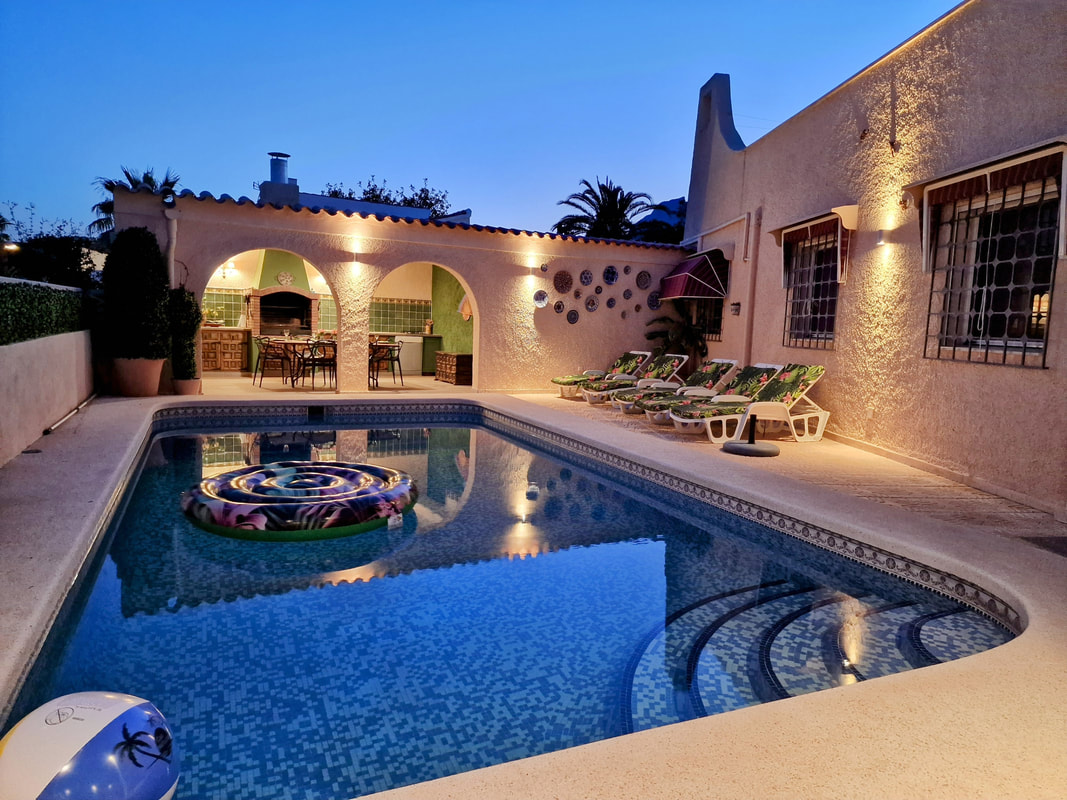 Pool at dusk with ambient terrace lighting